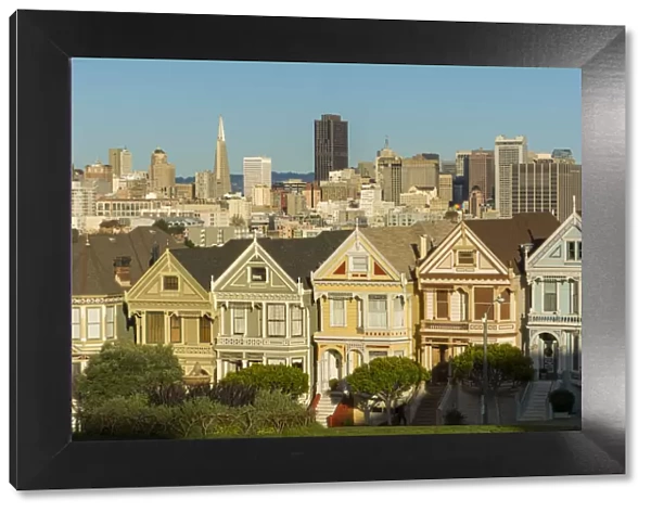 San Francisco California Painted Ladies Victorian homes and city in background at