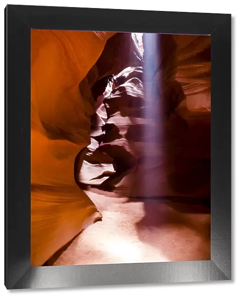 Page, Arizona. Upper Antelope Canyon. Ray of light streams down from the open slot