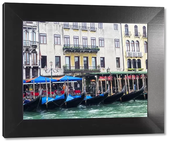 Europe; Italy; Venice; Buildings along the Grand Canal with Gondolas parked