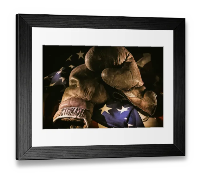 Framed Print : A pair of vintage boxing gloves laying on a flag carefully painted with light Framed Print : A pair of vintage boxing gloves laying on a flag carefully painted with light