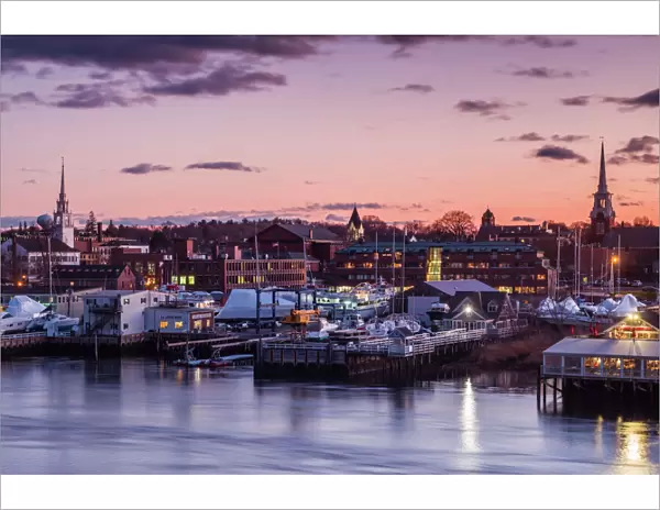 USA, Massachusetts, Newburyport, skyline from the Merrimack River at dusk