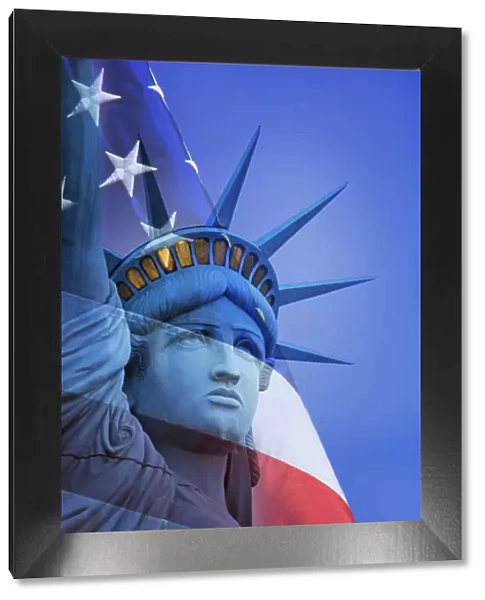 USA, Nevada, Las Vegas. Statue of Liberty and American flag composite. Credit as