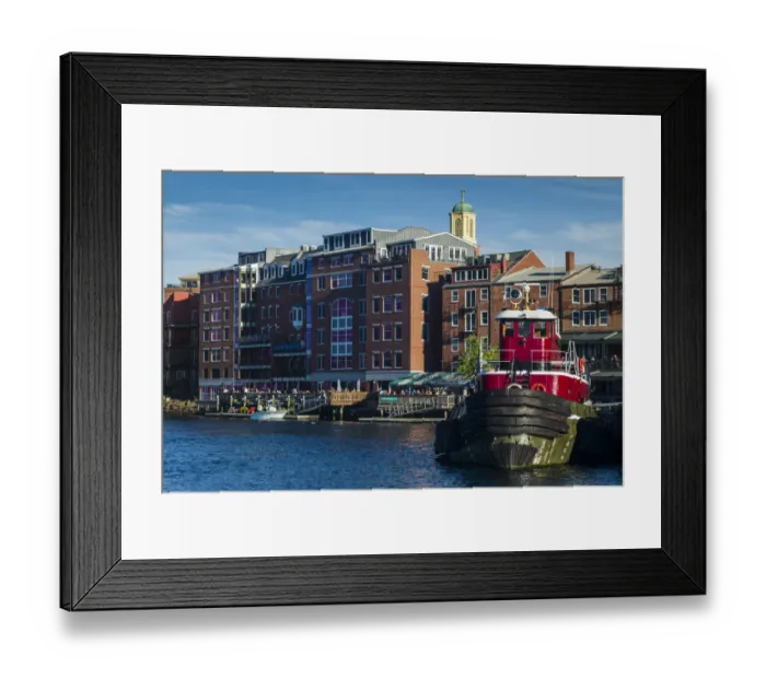 Framed Print : USA, New Hampshire, Portsmouth, waterfront buildings with tugboat