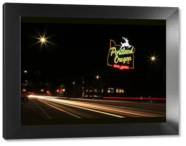 USA, Oregon, Portland. Neon sign in Old Town and traffic blur