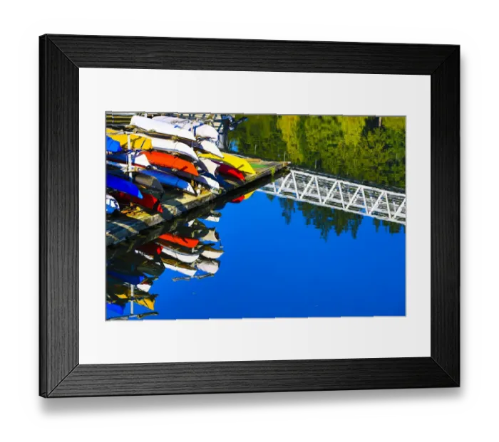 Framed Print : Port Ludlow Marina, Washington. Colorful kayaks and a white bridge on the dock