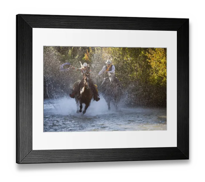 Framed Print : USA, Wyoming, Shell, The Hideout Ranch, Cowboy and Cowgirl on Horseback Running through the River Framed Print : USA, Wyoming, Shell, The Hideout Ranch, Cowboy and Cowgirl on Horseback Running through the River