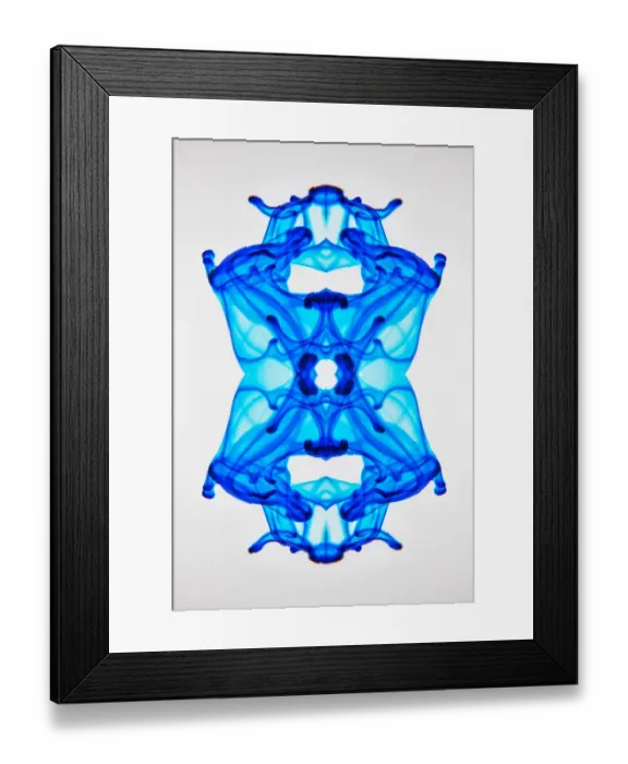 Framed Print : Food coloring dropped into glass of water and dispersing