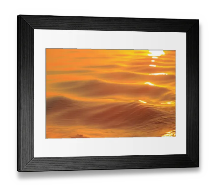Framed Print : Sunset colors and patterns on small waves in water Framed Print : Sunset colors and patterns on small waves in water