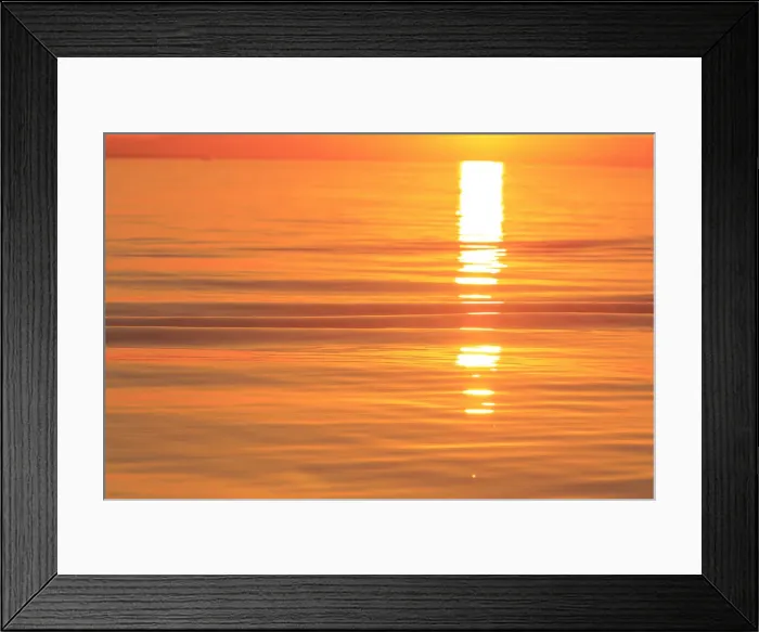 Framed Print : Sunset colors and patterns on small waves in water
