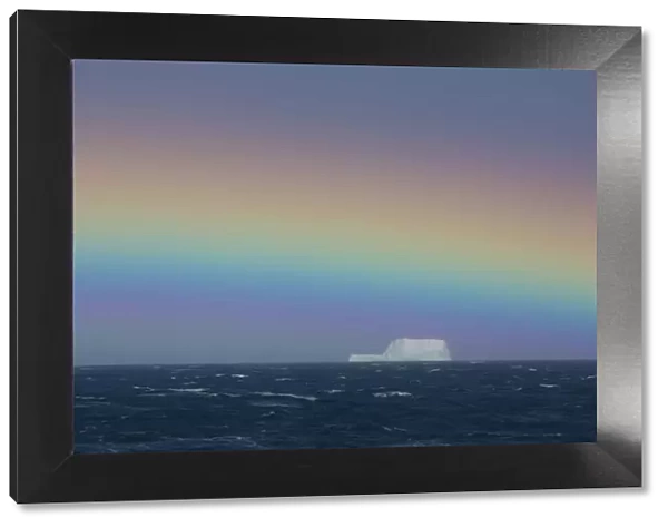 Rainbow over iceberg, South Georgia in the South Atlantic Ocean