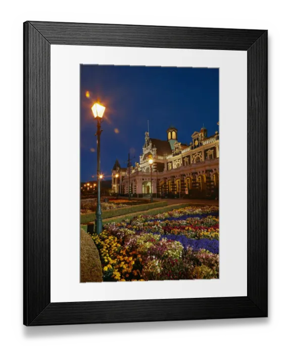 Framed Print : Flower garden and historic Railway Station at night, Dunedin, South Island, New Zealand Framed Print : Flower garden and historic Railway Station at night, Dunedin, South Island, New Zealand