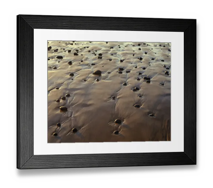 Framed Print : USA, Oregon. Evening light defines wet beach with scattered rocks, near Oceanside