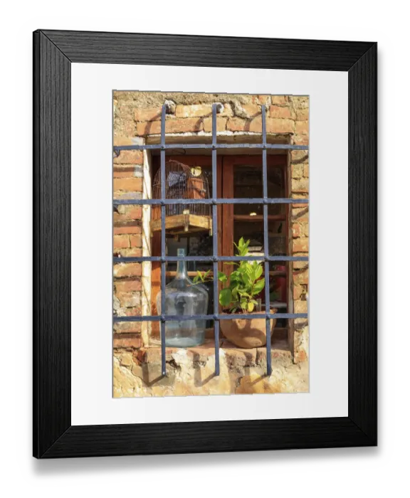 Framed Print : Italy, Monteriggioni. Stone wall, window with bars, wine bottle, bird cage and plant Framed Print : Italy, Monteriggioni. Stone wall, window with bars, wine bottle, bird cage and plant