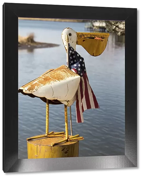 USA, Alabama. Whimsical pelican sculpture with American flag