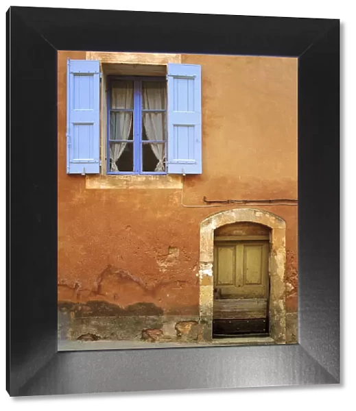France, Provence, Roussillon. Weathered window and door of house