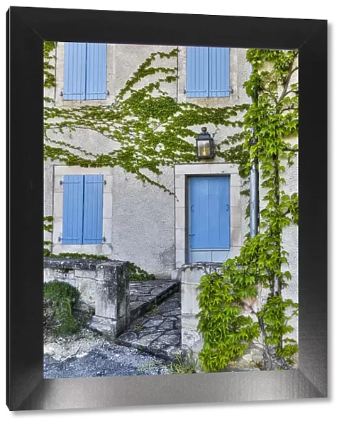 France, Lot River Valley. Home with blue shutters