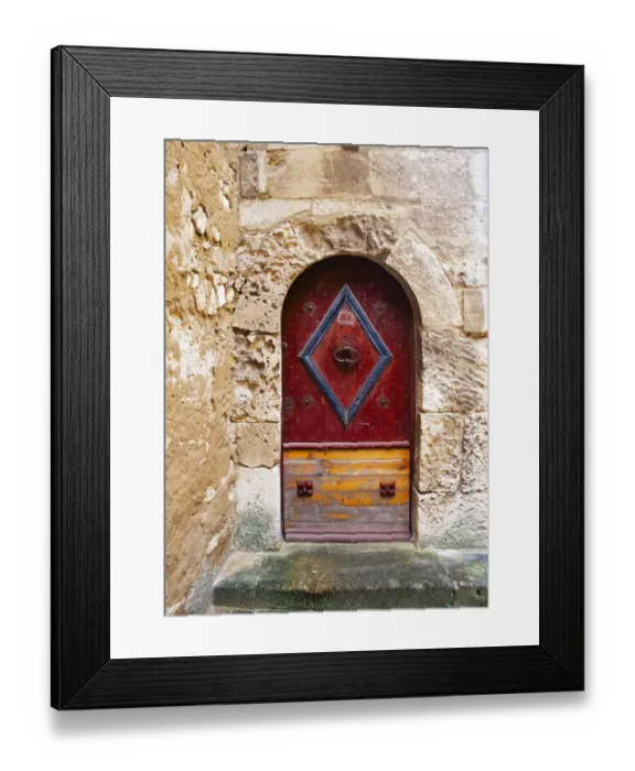 Framed Print : Colorful door in the stone wall of a chateau in France Framed Print : Colorful door in the stone wall of a chateau in France