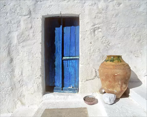 Greece, Symi. Blue door and pot. Credit as: Jim Nilsen  /  Jaynes Gallery  /  DanitaDelimont