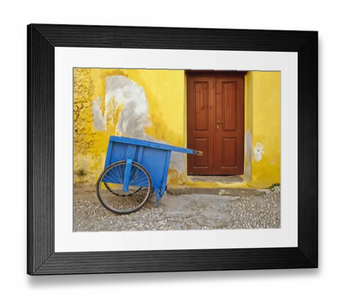 Framed Print : Greece, Rhodes. House with blue cart in front Framed Print : Greece, Rhodes. House with blue cart in front