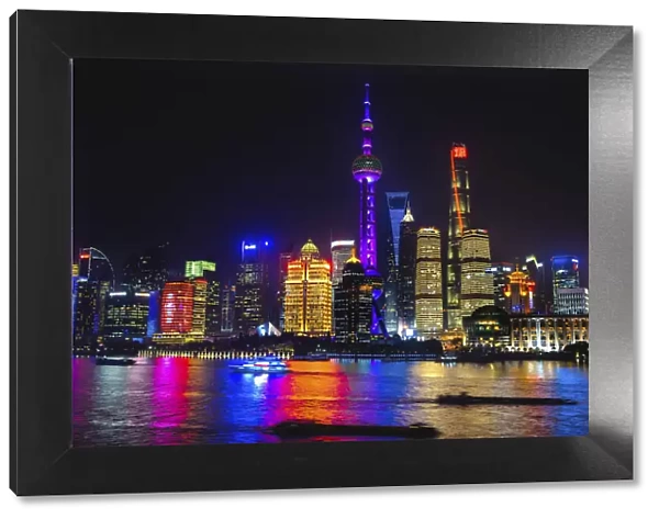 Oriental Pearl TV Tower. Reflection of cityscape at night, Shanghai, China