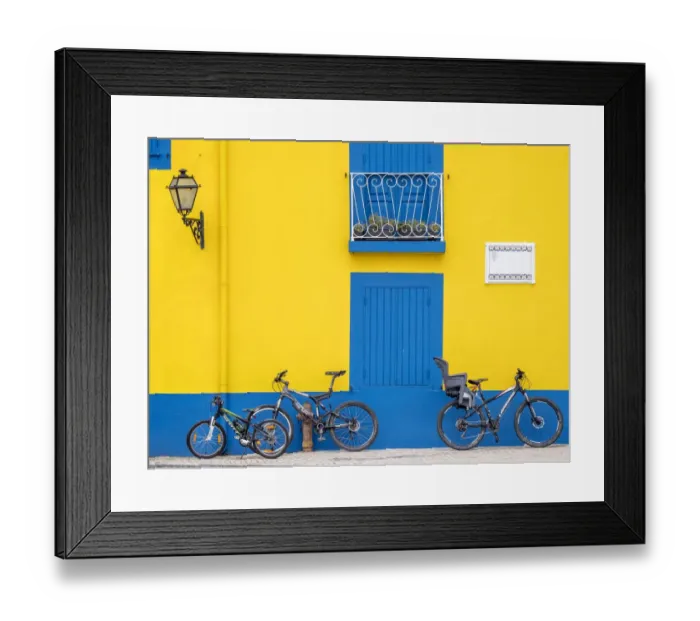 Framed Print : Portugal, Aveiro. Yellow house with blue shutters, windows and doors in the city of Aveiro