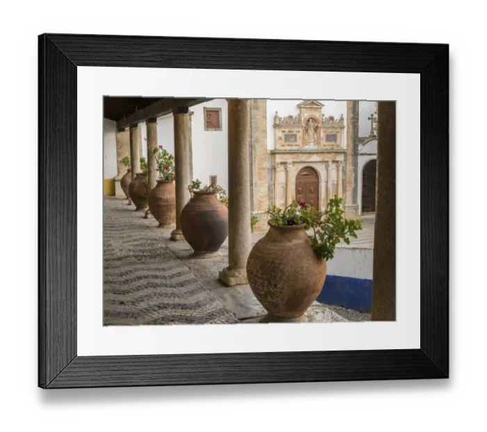 Framed Print : Europe, Portugal, Obidos. Ceramic pots adorn a ledge along a building