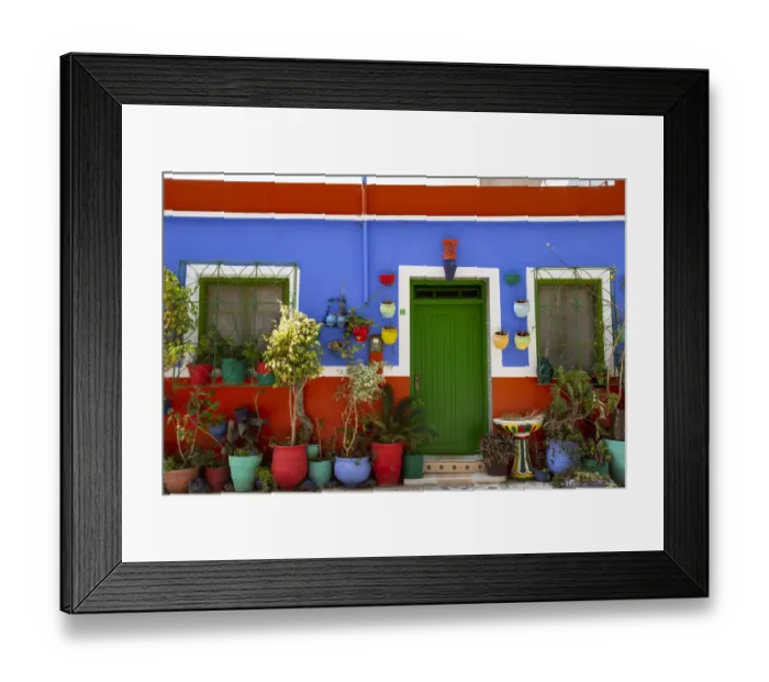 Framed Print : Asilah, Morocco, Multi-colored house with potted plants Framed Print : Asilah, Morocco, Multi-colored house with potted plants