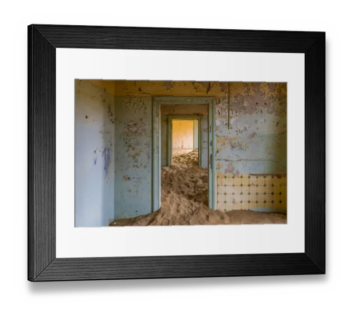 Framed Print : Africa, Namibia, Kolmanskop. Doorways and drifting sand in an abandoned diamond mining town