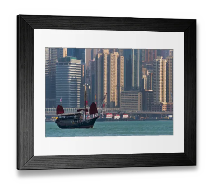 Framed Print : Junk boat and high-rise in Victoria Bay, Hong Kong, China Framed Print : Junk boat and high-rise in Victoria Bay, Hong Kong, China