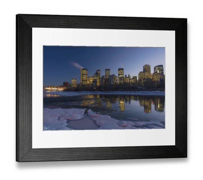 Framed Print : Winter city skyline reflects in the Bow River in Calgary, Alberta, Canada Framed Print : Winter city skyline reflects in the Bow River in Calgary, Alberta, Canada