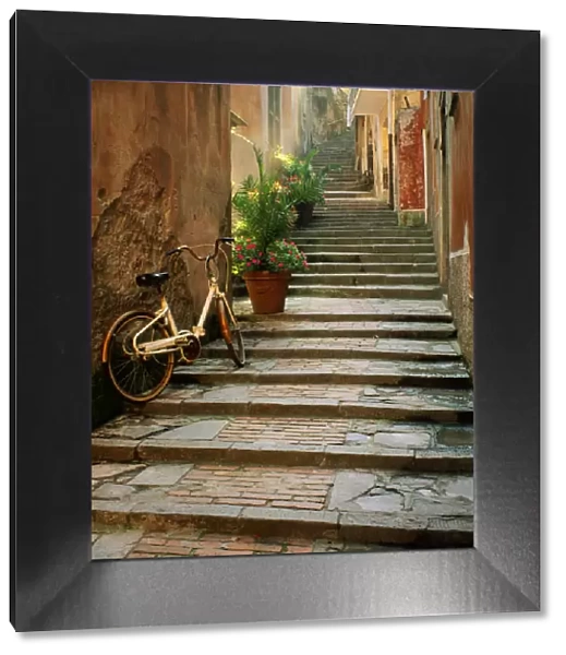 Italy, Cinque Terre, Monterosso. Bicycle and uphill stairway