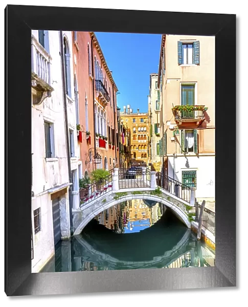 Reflection of buildings and boats, Venice, Italy
