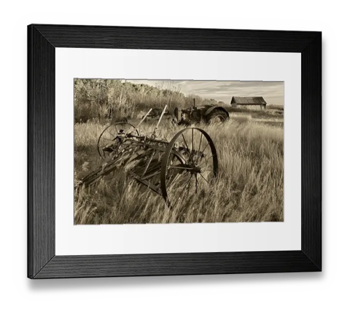 Framed Print : Canada. Black and white of old farm machinery in field