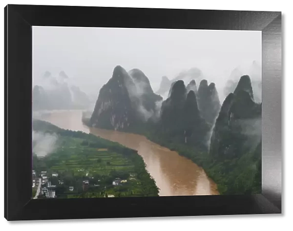 Li River and limestone hills in mist, Yangshuo, Guangxi, China