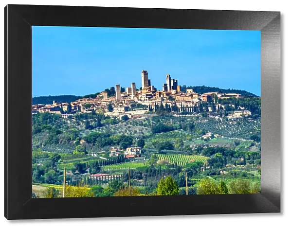 Medieval town of San Gimignano, Tuscany, Italy. Vineyards fields and hill town