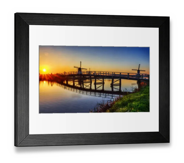 Framed Print : Netherlands, Kinderdijk. Windmill and bridge along the canal at sunrise