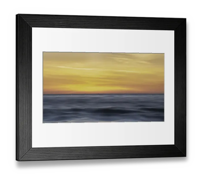 Framed Print : Sunset colors in the sky over the smooth ripples of the ocean