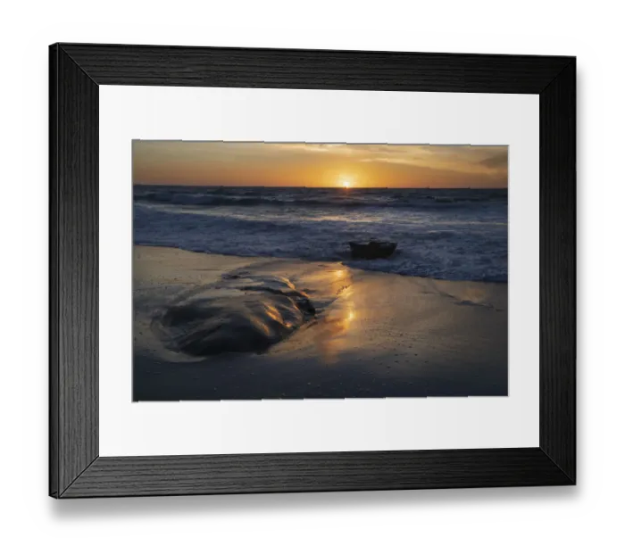 Framed Print : Sunset reflecting off the water on the sand of a beach Framed Print : Sunset reflecting off the water on the sand of a beach