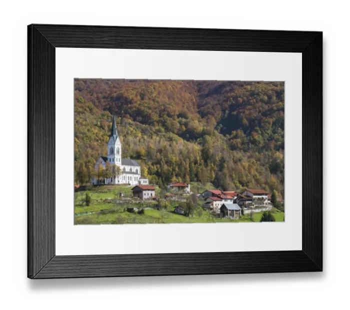 Framed Print : Slovenia, Dreznica. Parish Church of the Sacred Heart towers above the village, surrounded Framed Print : Slovenia, Dreznica. Parish Church of the Sacred Heart towers above the village, surrounded