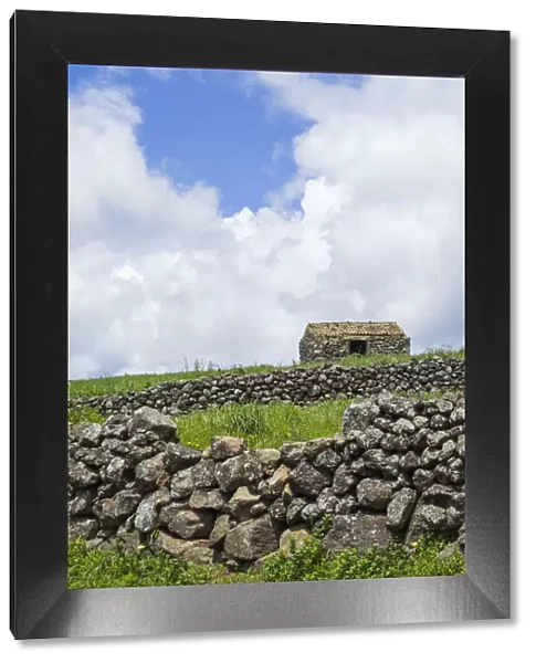 Portugal, Azores, Terceira Island, Serra do Cume. Stone wall