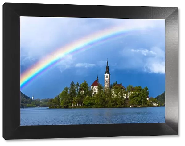 Europe, Slovenia. Rainbow over Lake Bled at sunset