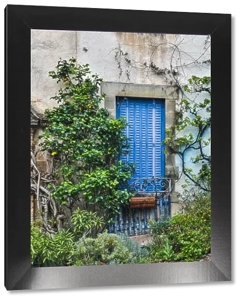 France, Najac. Blue shuttered window