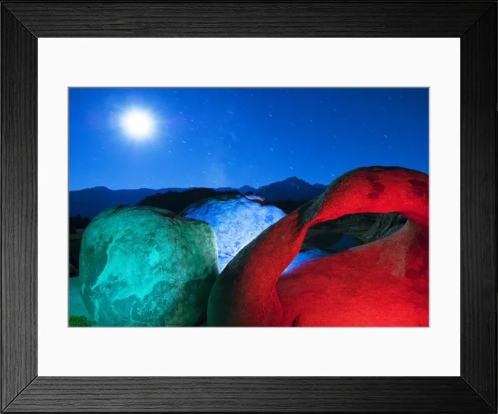 Framed Print : USA, California, Alabama Hills. Mobius Arch and rocks lit with colors on moonlit night