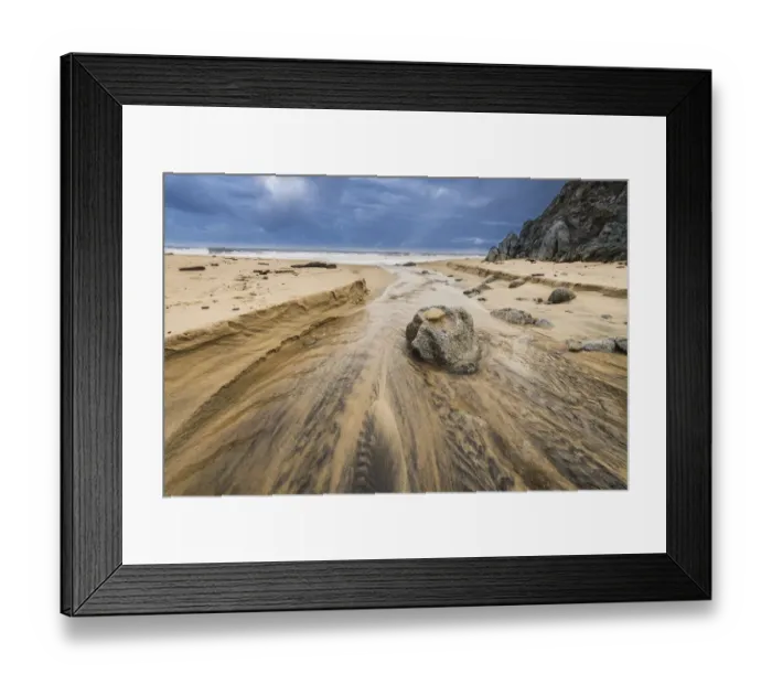 Framed Print : Stream flowing over a rock into the Pacific Ocean at Garrapata Beach, California