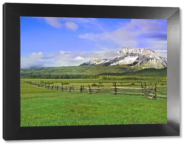 USA, Idaho, Sawtooth National Recreation Area. Landscape with split-rail fence. Credit as