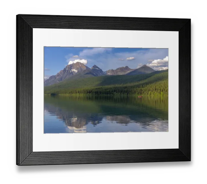 Framed Print : Fishing from a red canoe on the calm waters of Bowman Lake in Glacier National Park Framed Print : Fishing from a red canoe on the calm waters of Bowman Lake in Glacier National Park