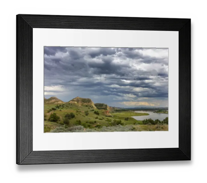 Framed Print : Badlands and storm clouds along the Yellowstone River near Culbertson, Montana, USA