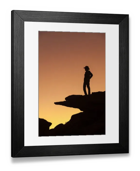 Framed Print : Man standing on rock surveying the view. (MR)