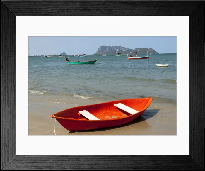 Framed Print : Thailand, Prachuap Khiri Khan. Ao Manao beach. Small colorful rowboats pulled up on the beach