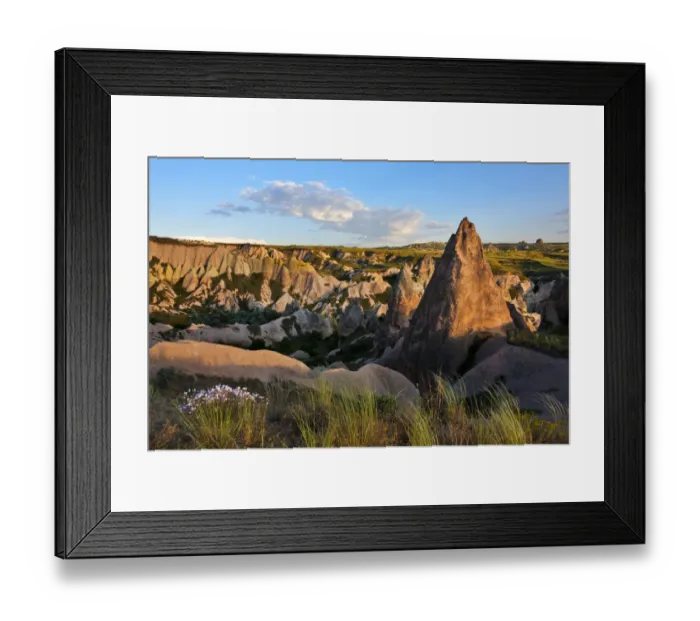 Framed Print : Rock formations in the valley. Goreme, Cappadocia, Turkey